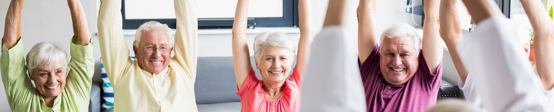 group of seniors exercising senior living wellness program