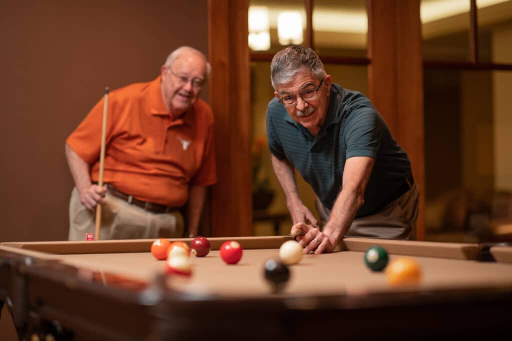 seniors playing pool at our community