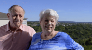 senior couple outside on patio area at Longhorn Village