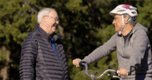 senior friends laughing outside at a independent living community