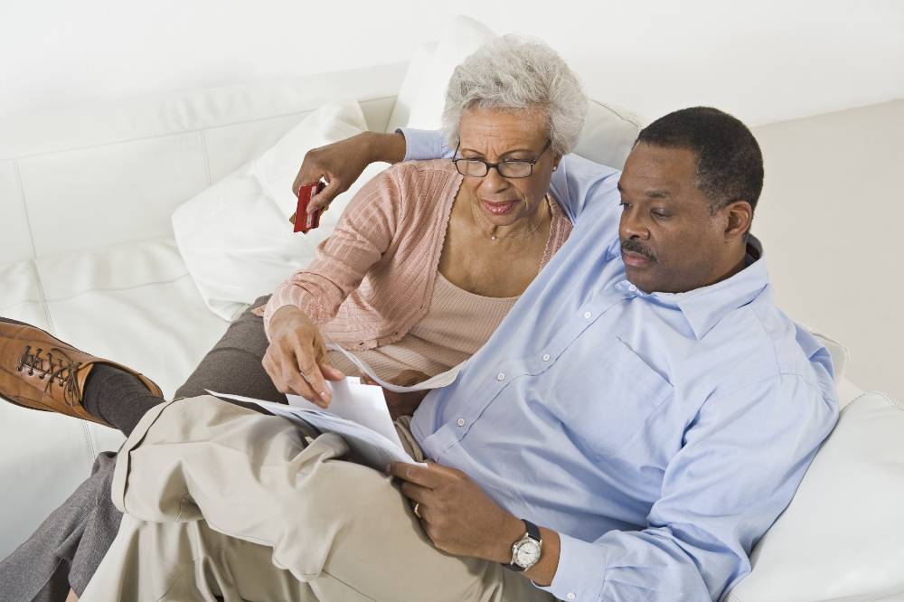 senior couple looking at paperwork together