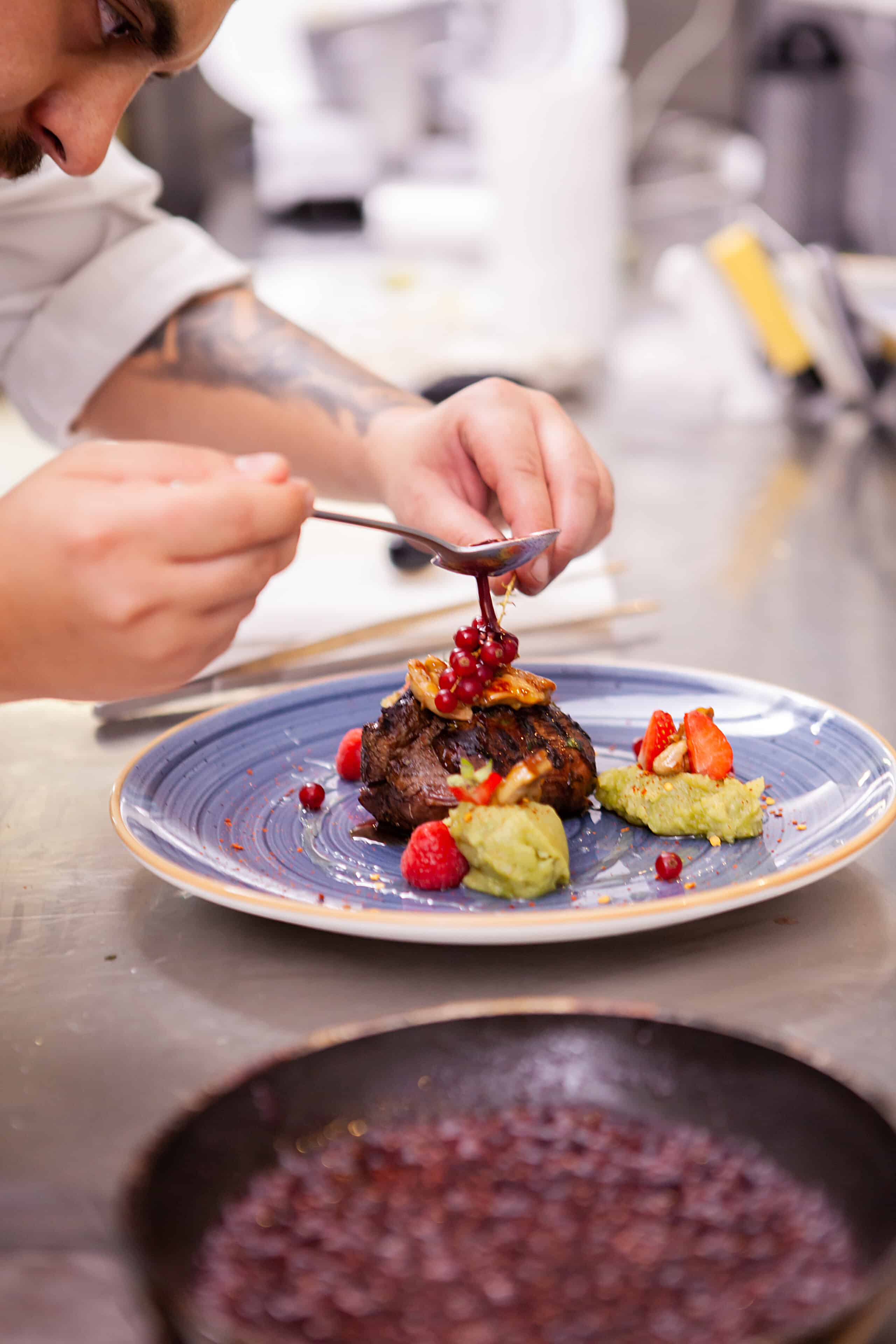 Professional food decoration in restaurant kitchen