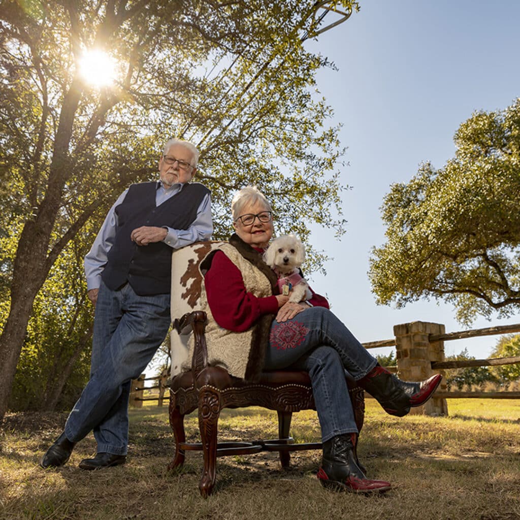 an elderly couple soaking sun in the outdoor campus