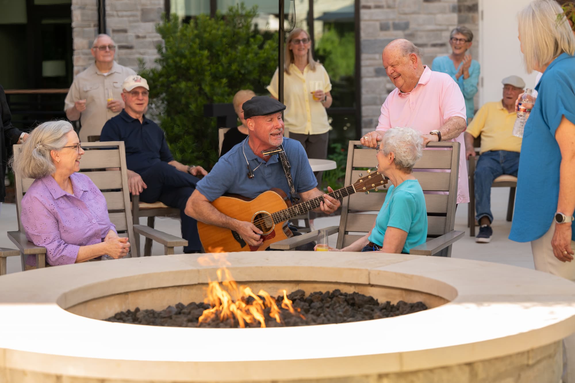 group of seniors sing along to a guitarist playing at LHV