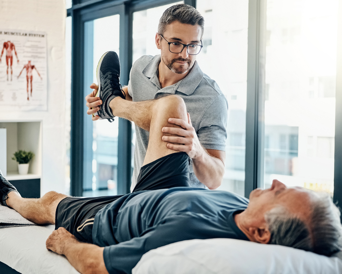 senior in rehab with young doctor at Longhorn Village senior Living Community